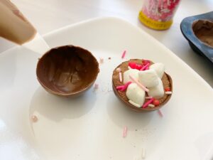 Make your own delicious Hot Cocoa Bombs at home for a tasty Valentine's Day treat! Includes easy step by step directions!