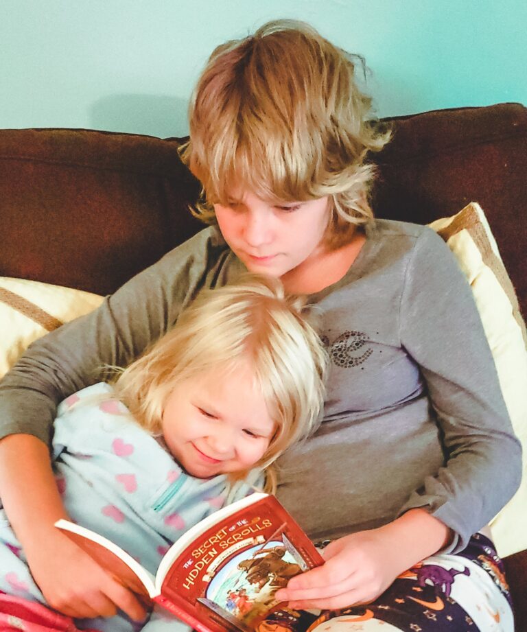 2 homeschooled children reading