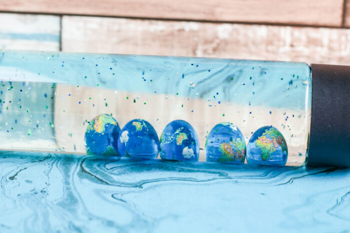 earth marbles in sensory bottle for earth day