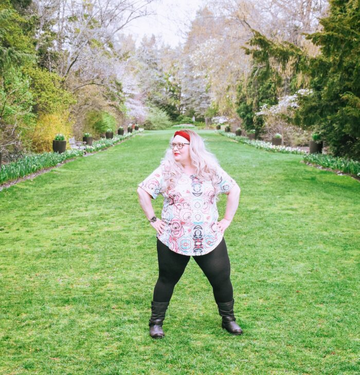 plus size model wearing spring tee and leggings and boots