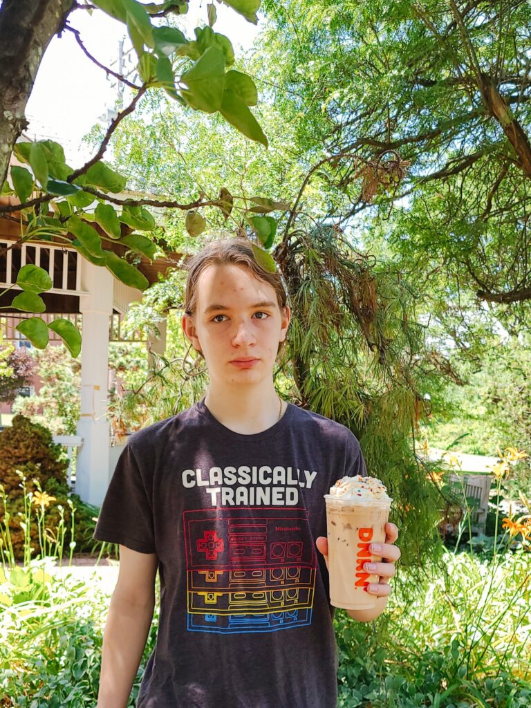 teenager holding coffee