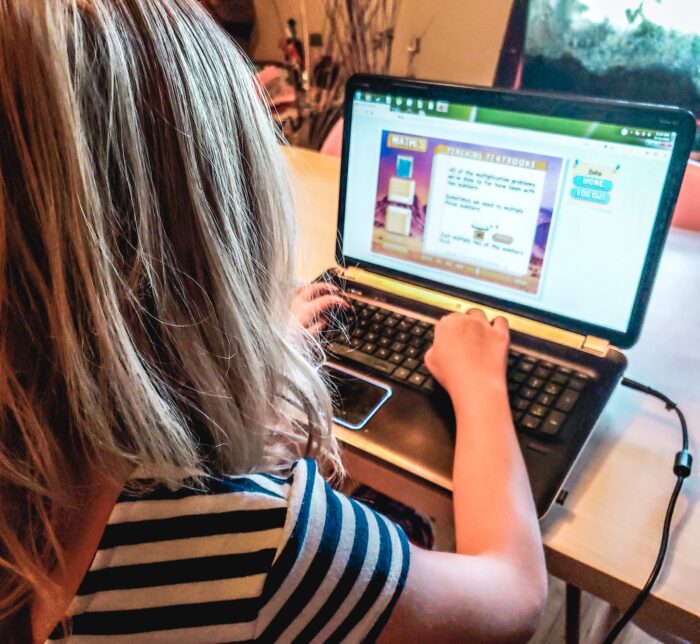 child using teaching textbooks as a homeschool program solution for on the go