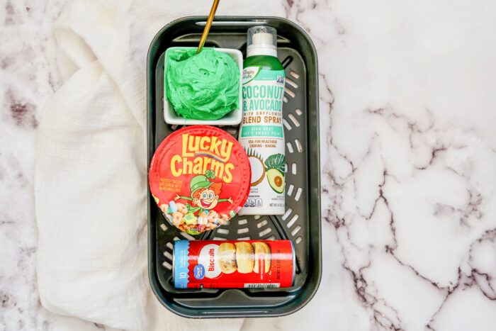 St. Patrick's Day Air Fryer Lucky Charms Donuts ingredients: lucky charms, avocado oil spray, biscuits can, icing