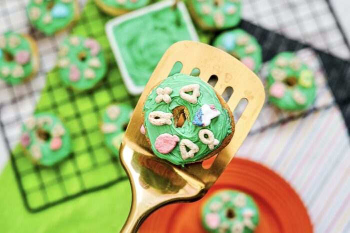 St. Patrick's Day Air Fryer Lucky Charms Donuts on a spatula